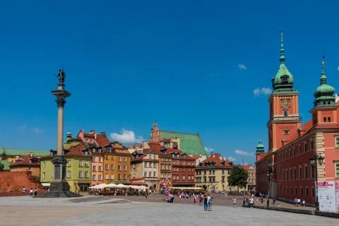 People walking in old city centre at sunny day time Stock Photos
