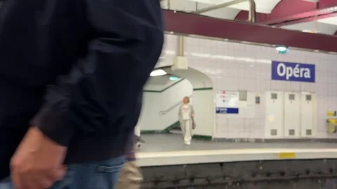 People walking at the Opéra metro station in Paris, France Stock Footage 337784338