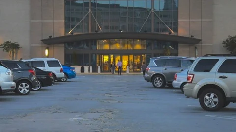 People walking out of store front Stock Footage 90098293