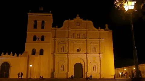 People walking outside the facade of and antique Stock Footage 140760438