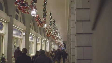 People walking outside the shops during Christmas eve Stock Footage 87148996