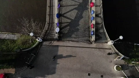People walking over the decorated bridge Stock Footage 87765697