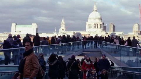 People walking over Millennium bridge, LONDON, Stock Footage 71913439