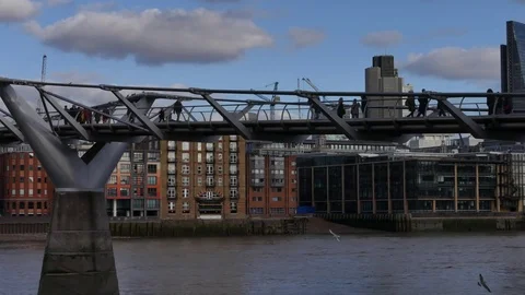 People walking over Millennium bridge, LONDON, Stock Footage 71951390