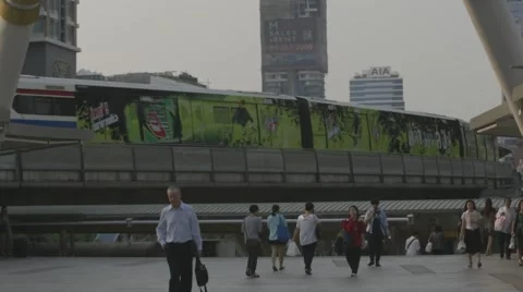 People Walking on overpass &amp; Skytrain at Chong Nonsi BTS Station (Slow Motion) Stock Footage 48619612
