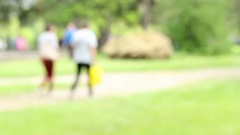 People walking in the park blurred Stock-Footage 76430962