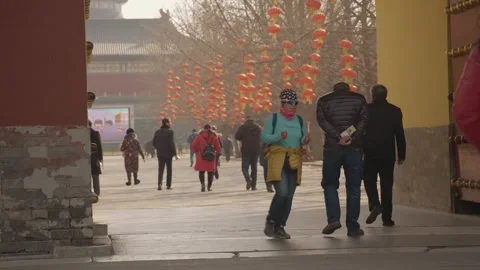 People Walking Past Red Lanterns at Temple of Heaven Entrance in Beijing, China Stock Footage 345832760