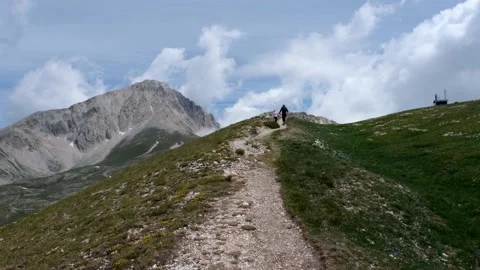 People walking on the path to the gran sasso d'italia abruzzo Stock Footage 158511332