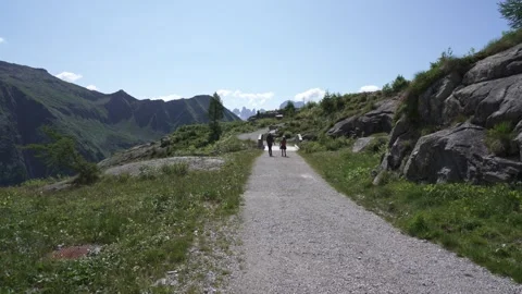 People walking on the path of the upper Val Nambrone Trentino 스톡 동영상 246625473