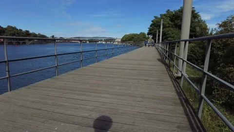 People Walking in a Pathway in the Riverfront - Douro River in Porto, Portuga Stock Footage 154463025