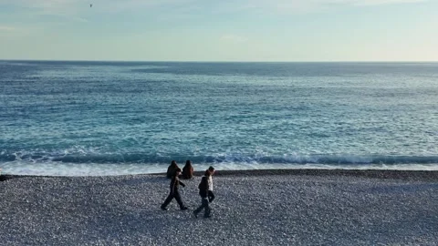 People Walking on Pebble Beach in Nice, France Stock Footage 329588485