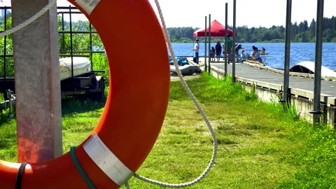 People Walking on a Pier Ready to Load to a Kayak Stock Footage 156638980
