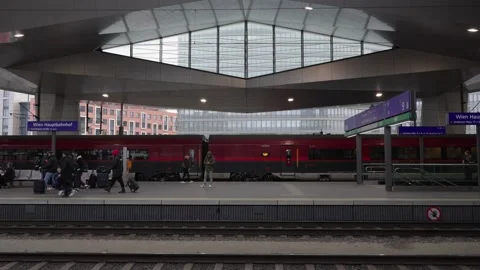 People walking on Platform in Vienna Main Train Station. Rail Jet Train Stock Footage 231226778