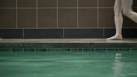 People walking on poolside, low section. 動画素材 88104561