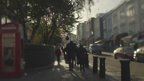 People walking in Portobello area, London in early morning Stock Footage