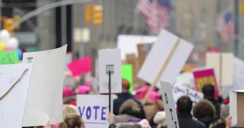People walking protesters protesting at Womens March in New York City Stock Footage 84834873