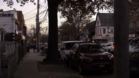People walking in Queens, NYC. Sunset in New York Stock Footage 200799628