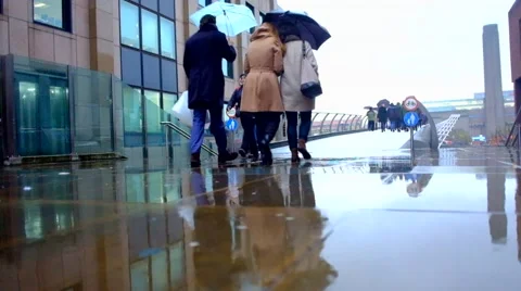 People walking in the rain Stock Footage 67683884