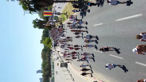 People walking with rainbow flags on Rokach Boulevard Stock Footage 197472595