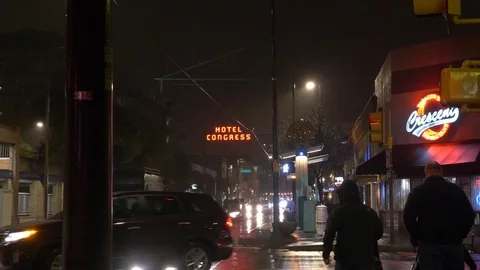 People walking on a rainy night in downtown Tucson, Hotel Congress Stock Footage 85953495