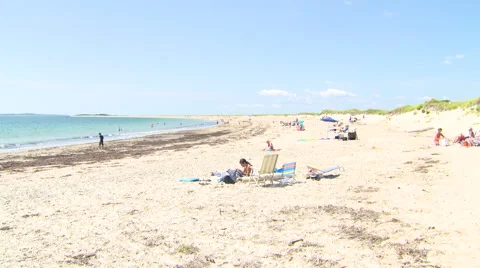 People walking on a rhode island beach in summer. Stock Footage 41069229