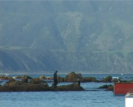 People walking on rocks 2 Stock Footage 140484