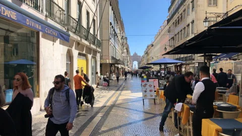 People Walking on Rua Augusta Main Promenade in Baixa Lisbon Stock Footage 139487511