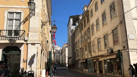 People Walking on Rue Rue De Comercio in Lisbon Portugal Stock Footage 139487549