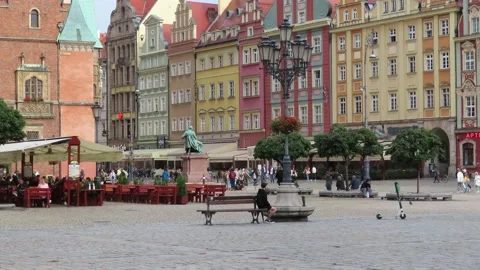People walking in the Rynek square of the Polish city of Wroclaw Stock Footage