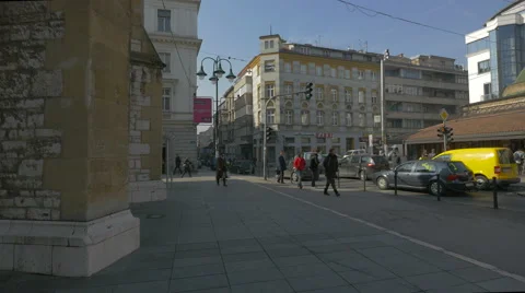 People walking by the Sacred Heart Cathedral in Sarajevo Stock Footage 59794815