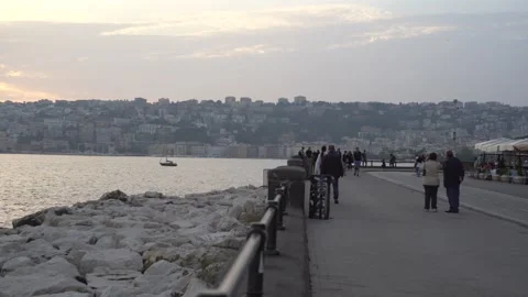 People walking by the seaside during sunset Via Partenope, Naples, Italy Video stock 323203327