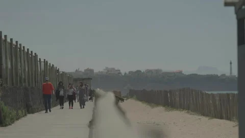 People walking on seaside path Video stock 342925286