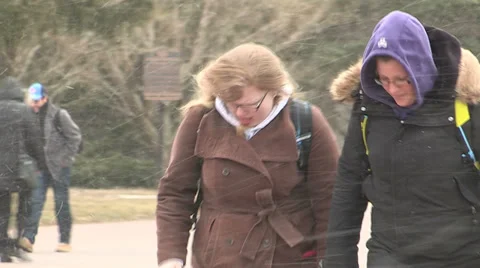 People walking in severe cold weather and snow storm Stock Footage 36691990