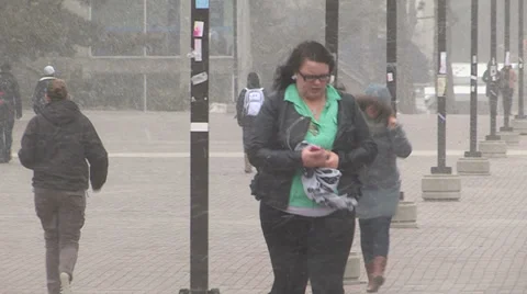 People walking in severe cold weather and snow storm Stock Footage 36693648