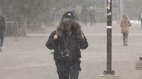 People walking in severe cold weather and snow storm Stock Footage 36693678