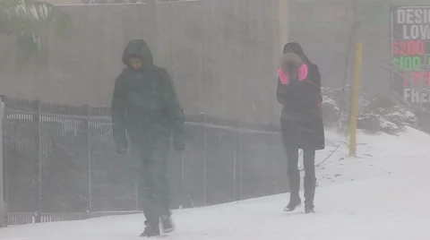 People walking in severe cold weather and snow storm Stock Footage 37190811