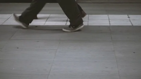 People walking on a sidewalk Stock Footage 70553702