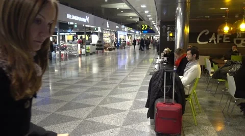 People walking, sitting, shopping and dining in Helsinki-Vantaa airport Stock Footage 59798024