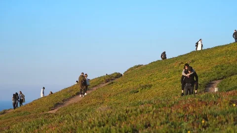 People walking in slow motion at Cape Roca, Portugal. Stock Footage 110761216
