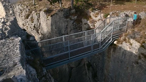 People walking on small footbridge Stock Footage 151081011