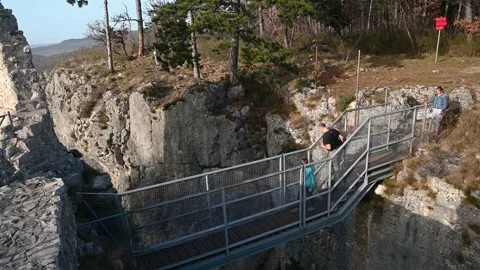 People walking on small footbridge Stock Footage 151081013