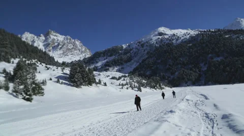 People walking in snowy landscape Stock Footage 36963568