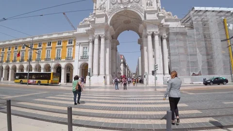 People walking Square do Comercio in downtown Lisbon Stock Footage 90673530