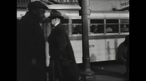 People walking on street and bus leaving from stop Stock Footage