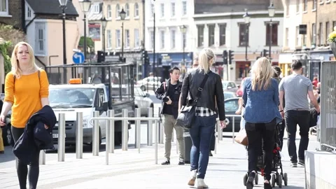 People walking on the street next to the Cutty Sark Tea Clipper in Greenwich Stock Footage 166364270