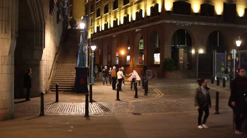 People walking on the street next to the Tower Bridge Stock Footage 166364415