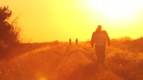 People walking on sunset2 Stock Footage 918047