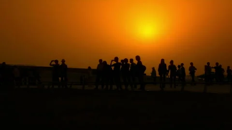 People Walking at sunset_wide Stock Footage 46028965