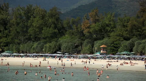 People walking, swimming, snorkeling, Kata Beach in Phuket Island, Thailand Stock Footage