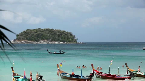 People walking, swimming, snorkeling, Kata Beach in Phuket Island, Thailand Stock Footage